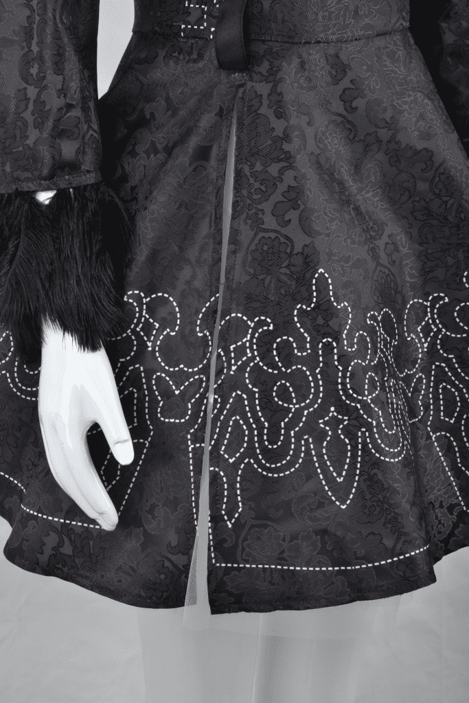Close-up of the YoRHa No. 2 Type B cosplay costume showing fabric texture and embroidery. 