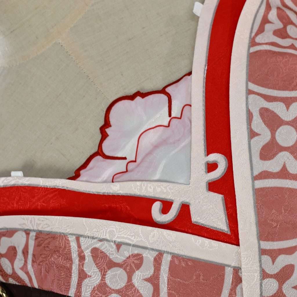 Close-up of Tingyun cosplay's accessories and fabric pattern