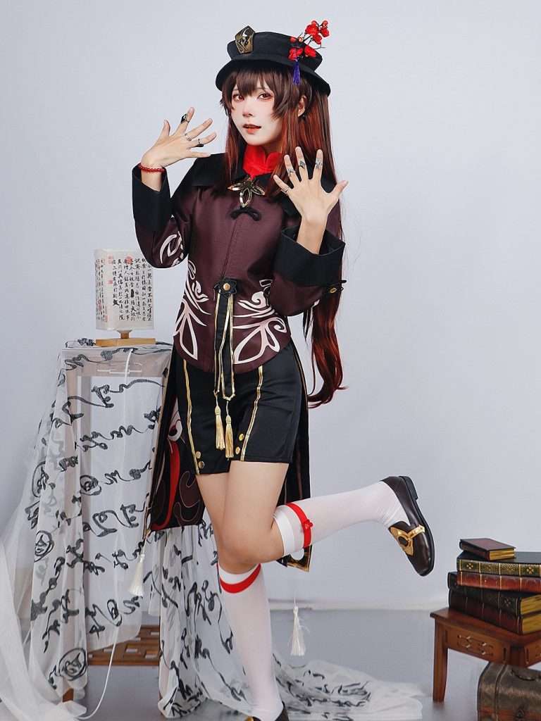 A model wearing the Hu Tao cosplay costume from Genshin Impact, showcasing the full outfit with accurate details.