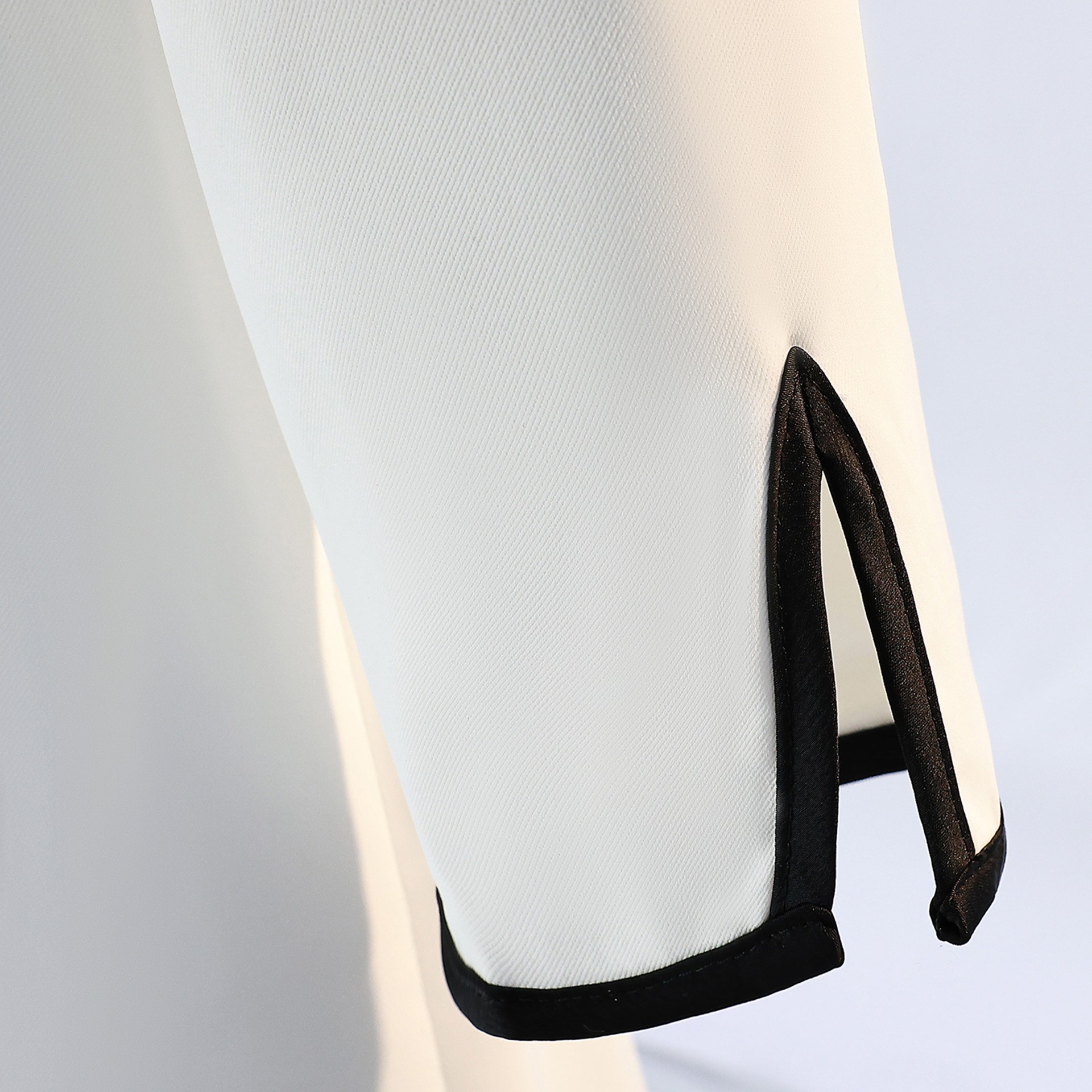 Fabric close-up of Kamui black and white suits